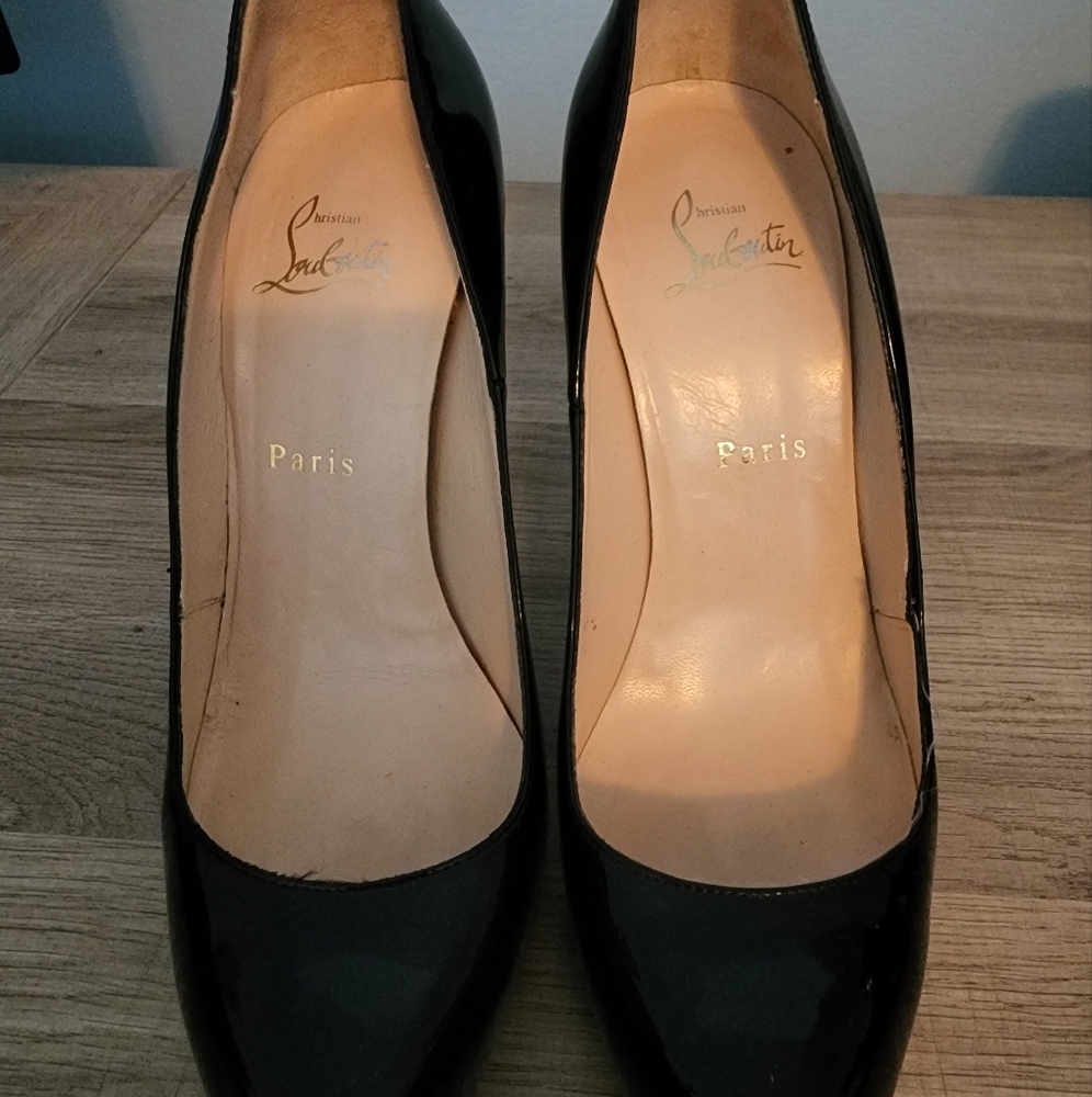 Women’s Christian Louboutin  Rolando black patent pump.